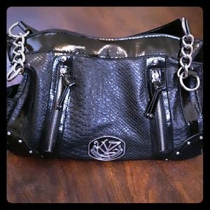 Kathy Van Zeeland black leather bag